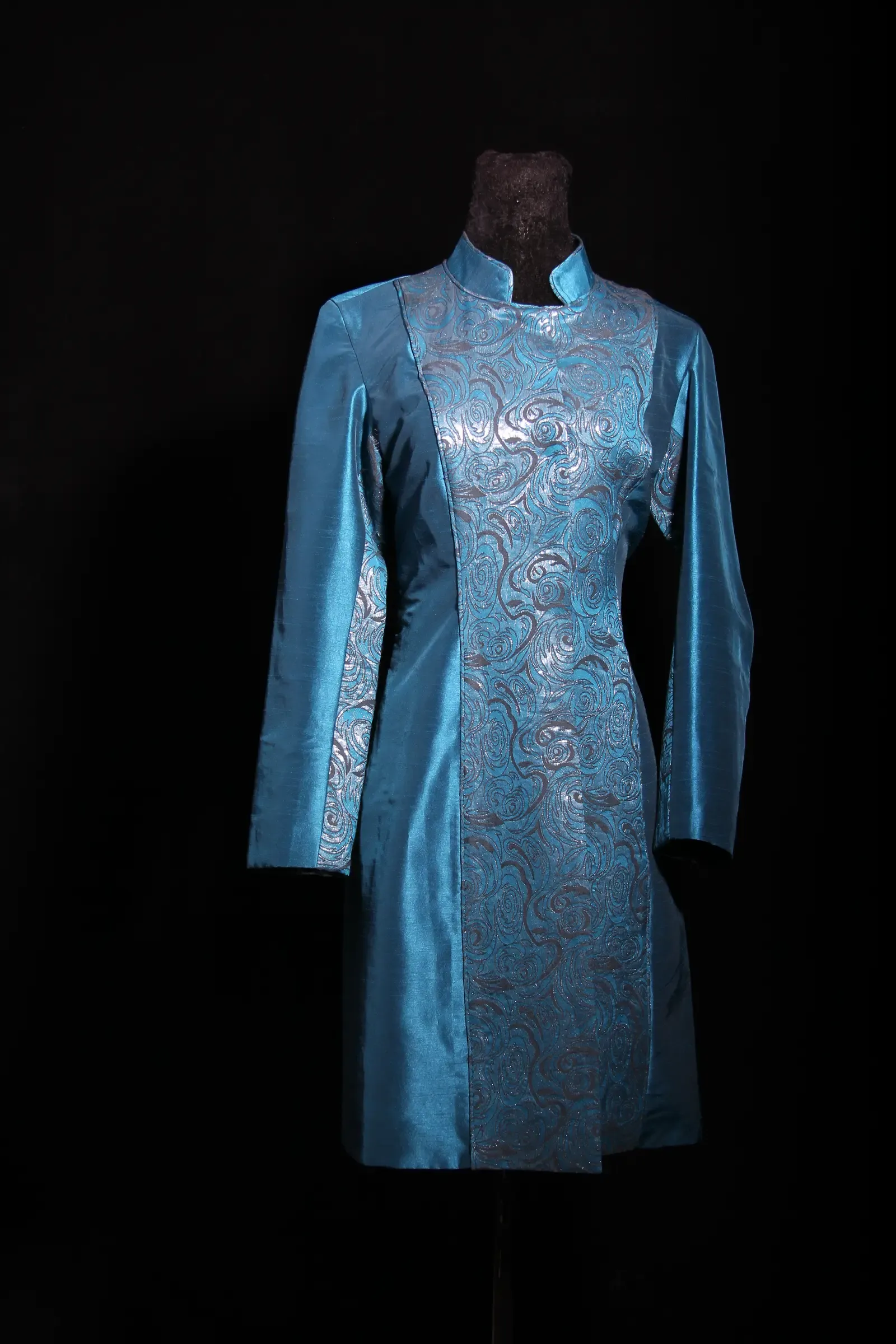 Teal embroidered coat — front view